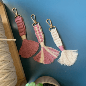Handcrafted light mauve pink and off white macrame keychain with cotton tassels and gold clasp